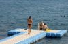 3 women on a sunny dock