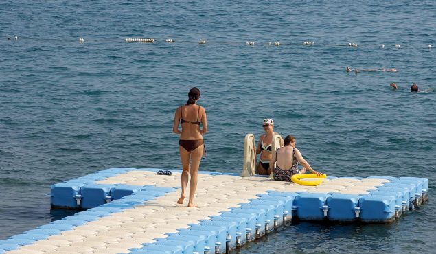 3 women on a sunny dock