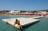 ladies sitting on a sunny dock