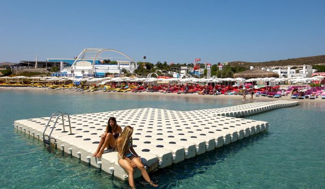 ladies sitting on a sunny dock