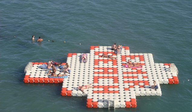 people lounging on a dock