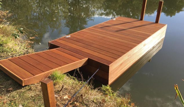 Decked pontoon with gangway and moorings for swimmers at Heckfield Place, Hampshire.