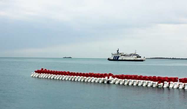 ships next to wave breakers