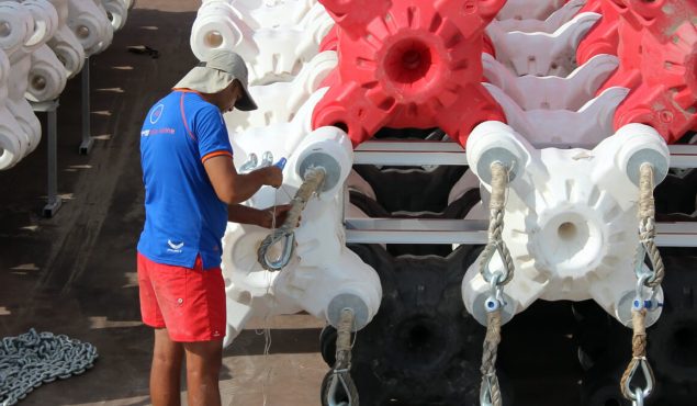 man examining wave breakers