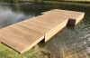 Decked pontoon with gangway and moorings for swimmers at Heckfield Place, Hampshire.