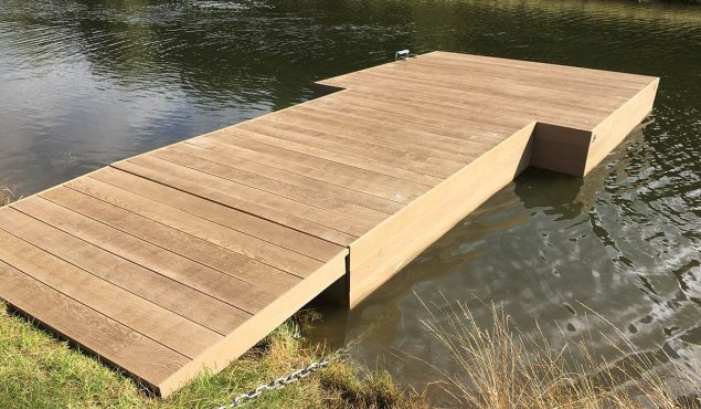 Decked pontoon with gangway and moorings for swimmers at Heckfield Place, Hampshire.