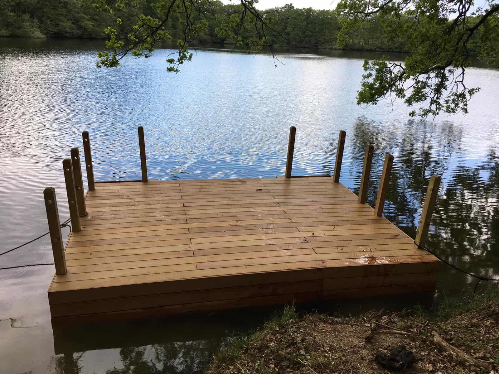 Decked pontoon with wooden handrails, almost finished.