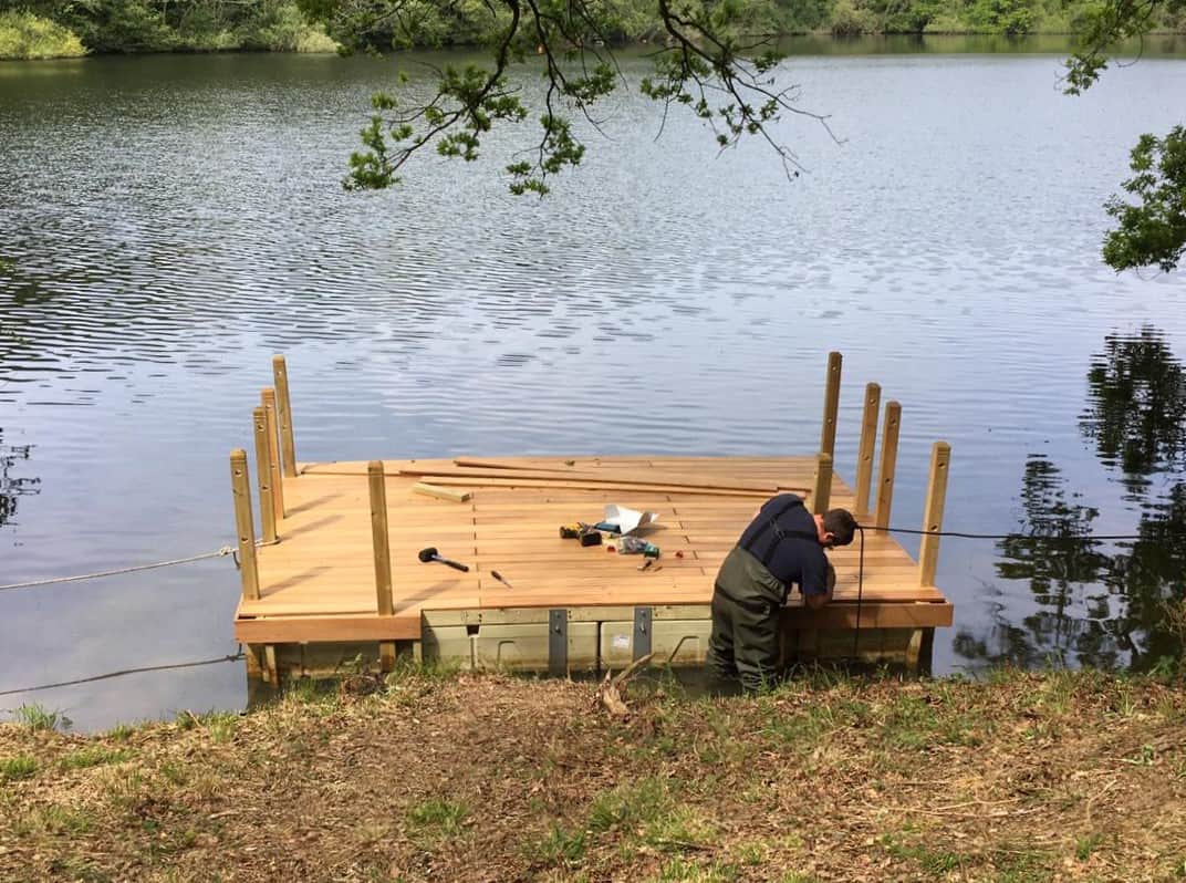 Decked pontoon on Rotodock with handrails, being built.