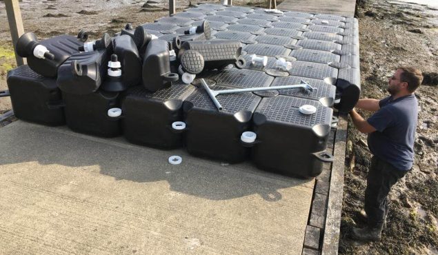 Modular cube pontoon to be attached to jetty with pilings