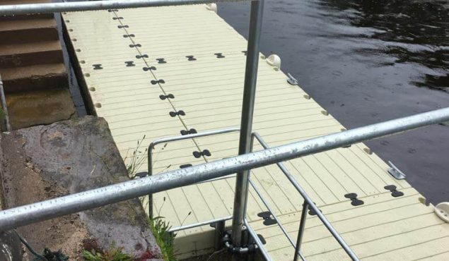A 24m x 2m Rotodock pontoon with pile moorings and a staggered inlet in Totnes, Devon