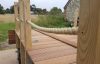 Decked pontoon being made with handrail posts and synthetic hemp rope