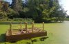 Decked pontoon with handrails, framework on show