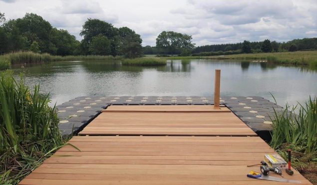 Decked pontoon surrounded by modular cubes