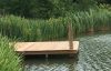 Decked pontoon on lake