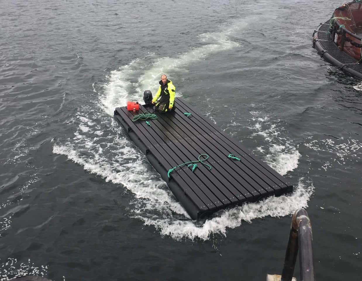 Pipe pontoon being used as a motorised raft