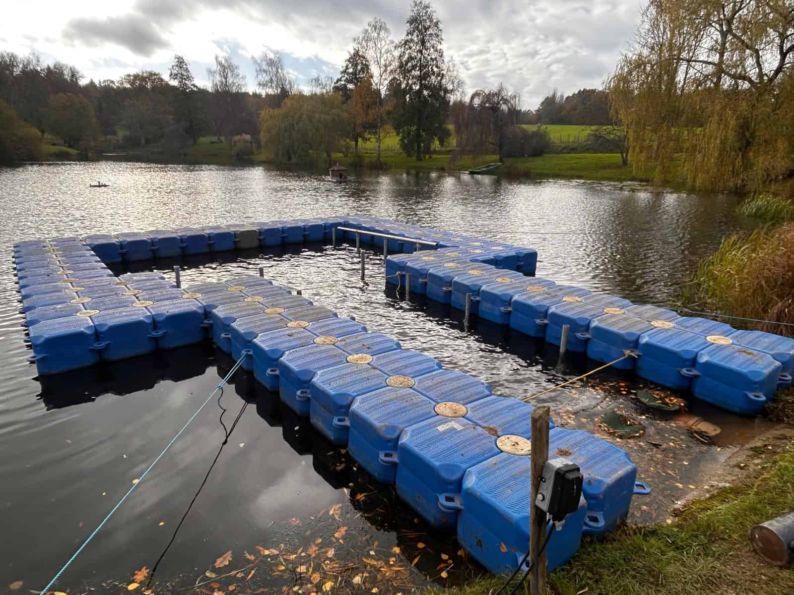 Modular Cubes surrounding the footprint of the jetty, with the jetty's piles in place.