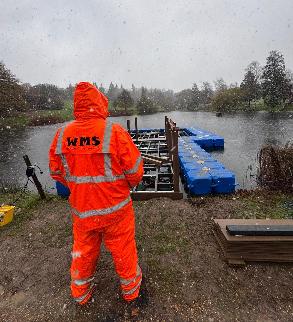 WMS installer stood in the lightly falling snow